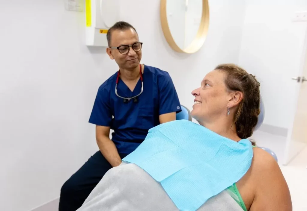 Discussing Payment Plans With The Patient At Carina Gardens Dental