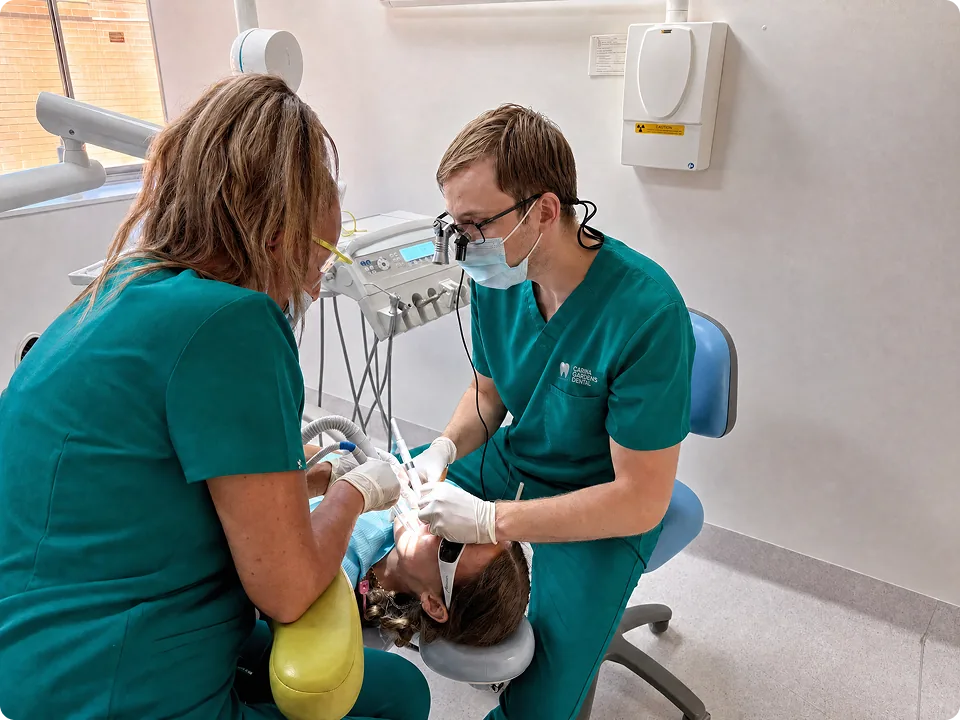 Dentist and dental assistant treating a patient during an emergency dental appointment at Carina Gardens Dental, Carina Brisbane