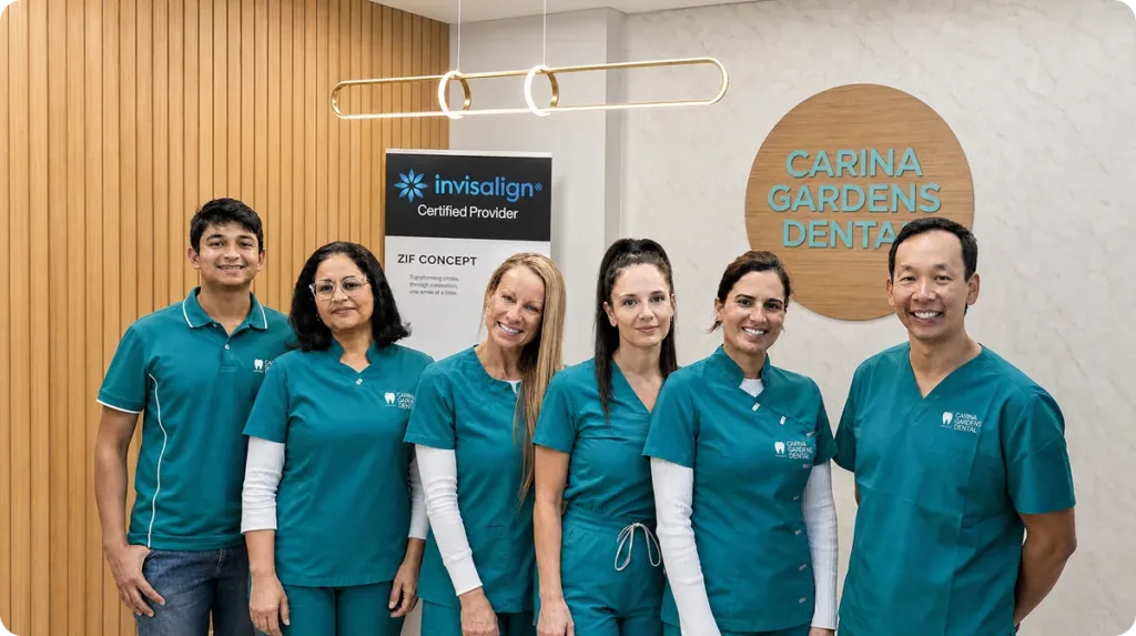 The Carina Gardens Dental team standing together in the clinic reception in Carina, Brisbane